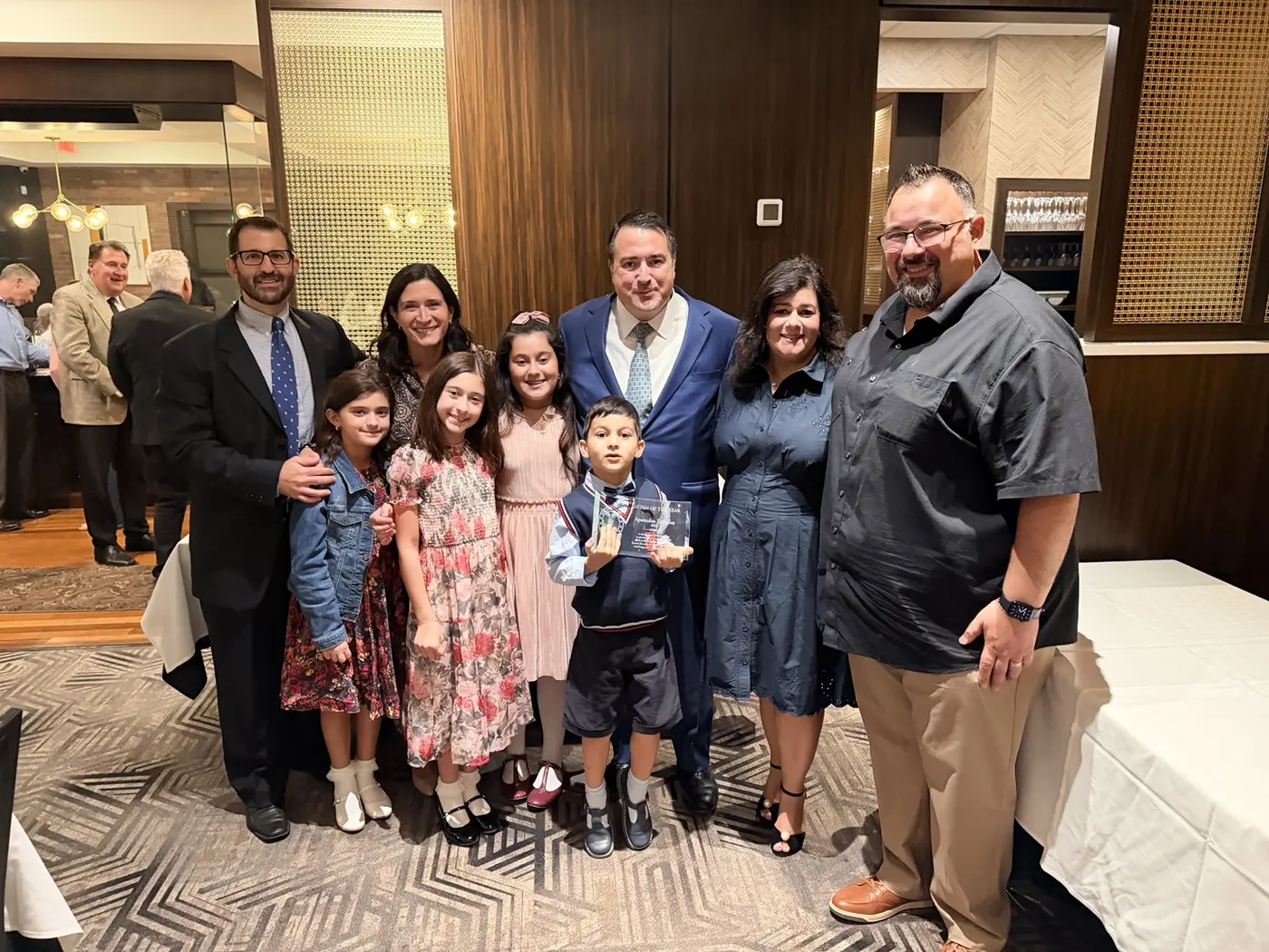Paul Zafiriou, center, with family and friends at the AHEPAN of the Year dinner