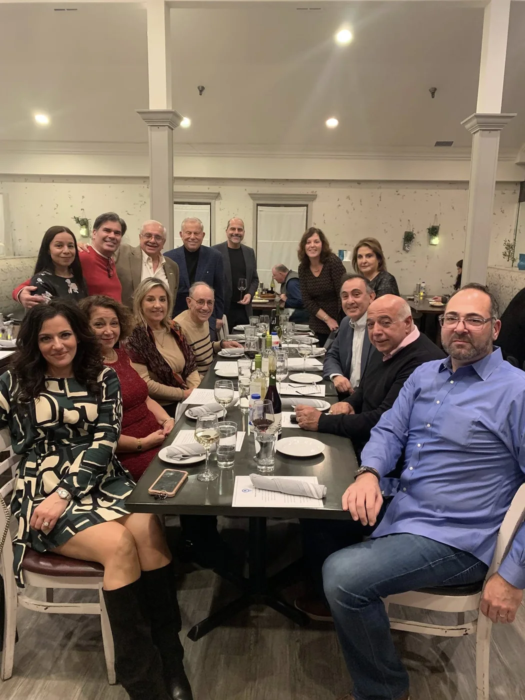 Chapter members and family gathered around a dinner table