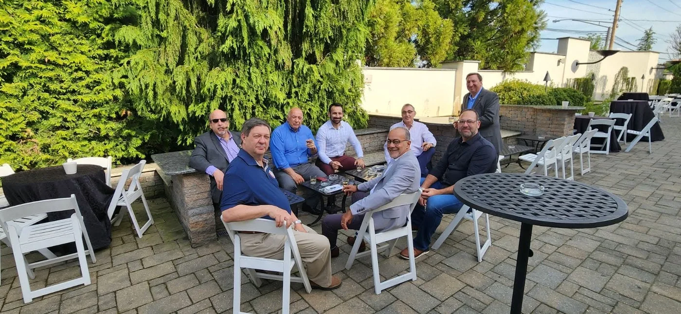 Brothers gathered together outdoors on a patio